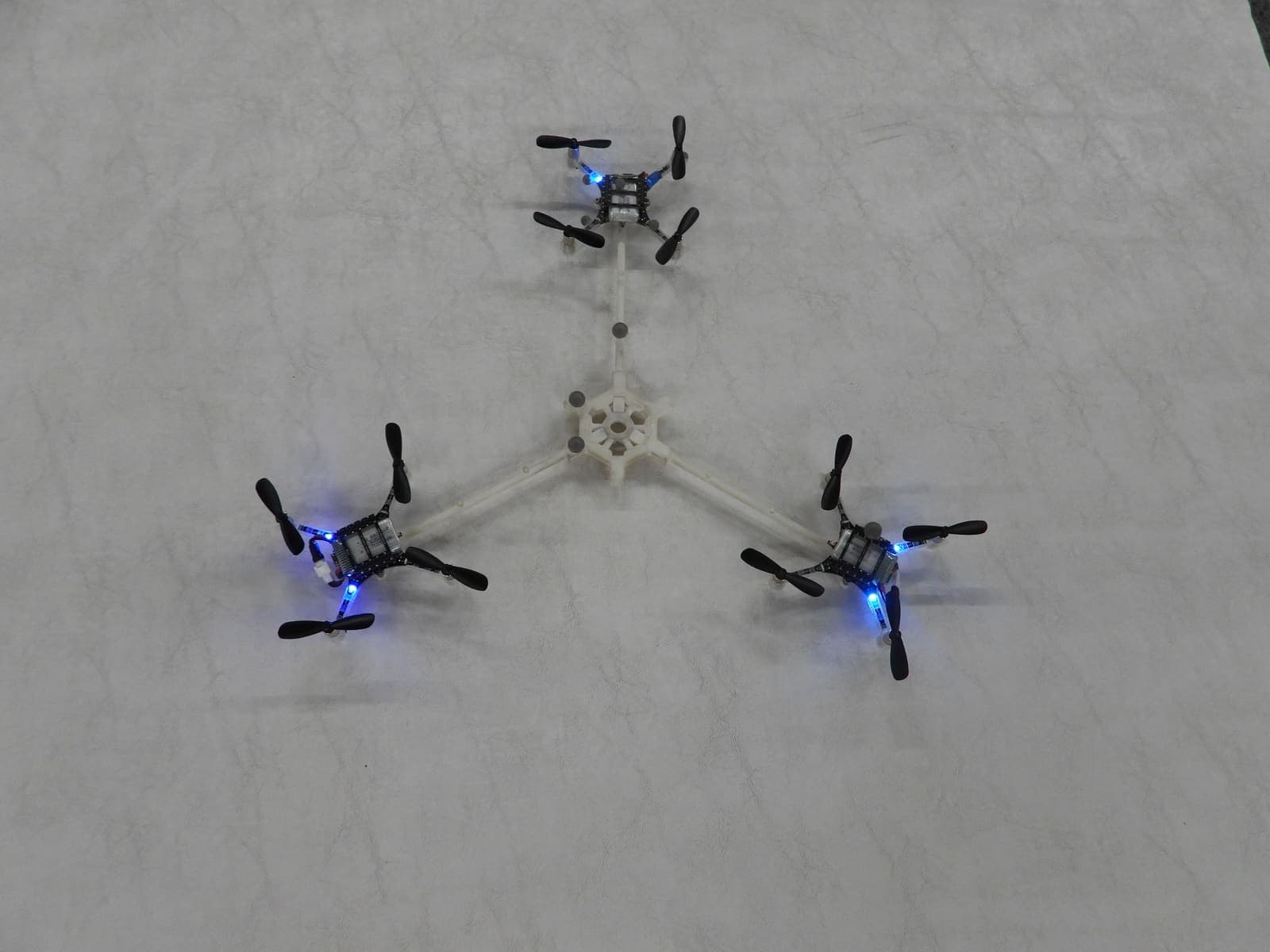 Modular tricopter prototype built from three linked rotor pods, on the test floor during the Dubai World Challenge