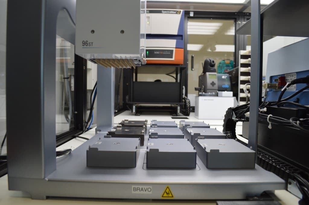 Agilent Bravo automated liquid handler with a 96-channel ST head over the microplate deck